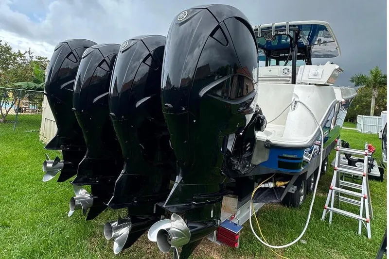 Slide: The Image of 2017 Hydra-Sports 4200 Siesta boat with four powerful outboard engines on a trailer. - 3