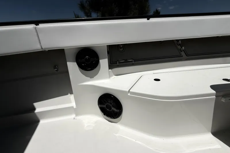 Slide: The Image of 2017 HCB 42 Siesta boat interior with speakers and storage compartments. - 56