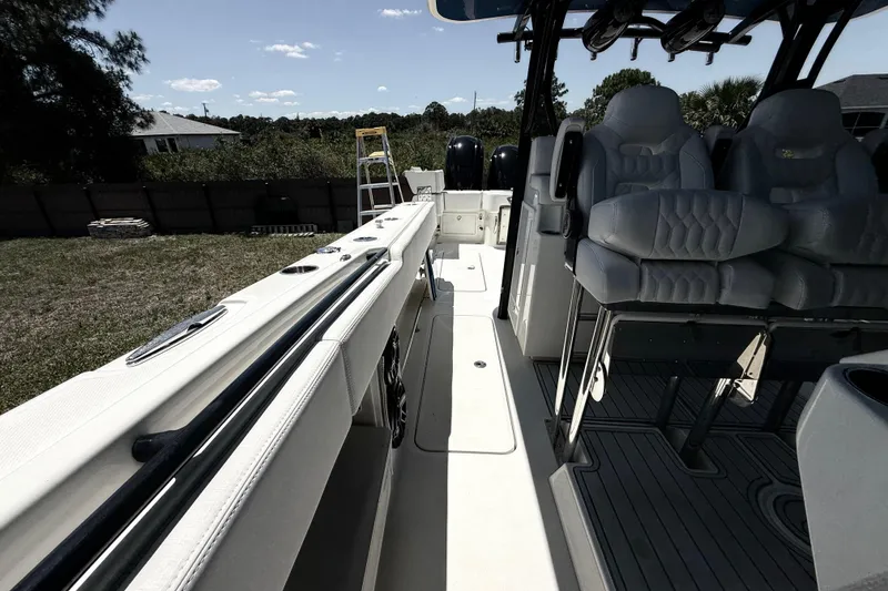 Slide: The Image of 2017 HCB 42 Siesta boat interior with seating and deck view. - 61
