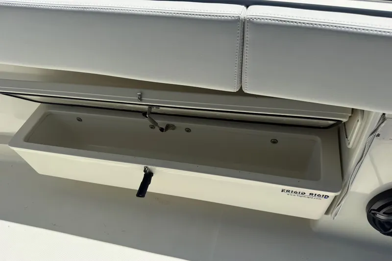 Slide: The Image of Open storage compartment on 2017 HCB 42 Siesta boat with Frigid Rigid cooler. - 62