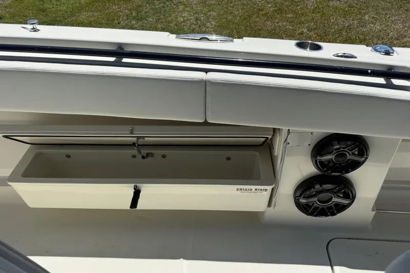 Slide: The Image of 2017 HCB 42 Siesta boat interior with storage compartment and speakers. - 63