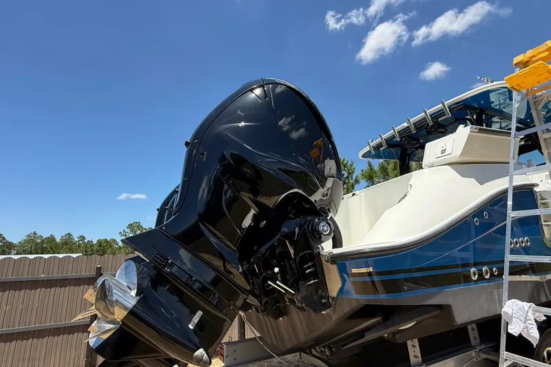 Slide: The Image of 2017 HCB 42 Siesta boat with powerful outboard motor under clear blue sky. - 69