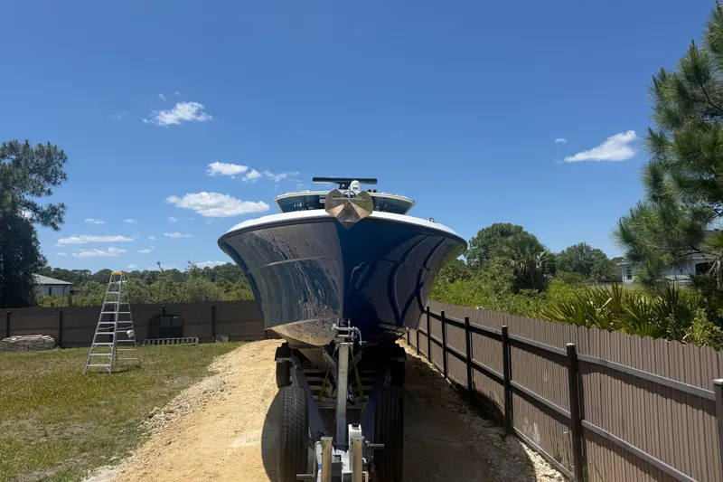 Slide: The Image of 2017 HCB 42 Siesta boat on trailer under clear blue sky. - 70