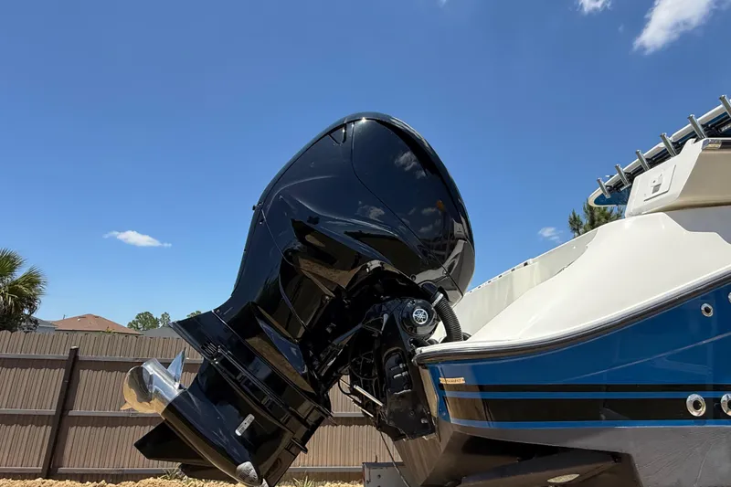 Slide: The Image of 2017 HCB 42 Siesta boat with powerful outboard motor against clear blue sky. - 71