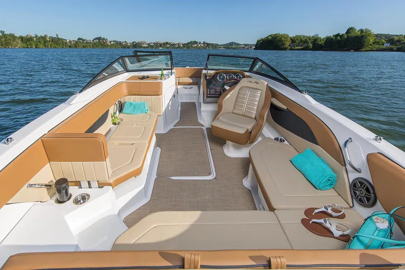 Slide: The Image of 2018 Sea Ray SPX 210 Outboard boat docked on a calm lake. - 1