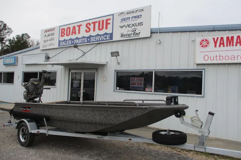 Slide: The Image of 2026 Gator Tail 1750 SAVAGE MIDDECK boat on trailer outside dealership. - 1