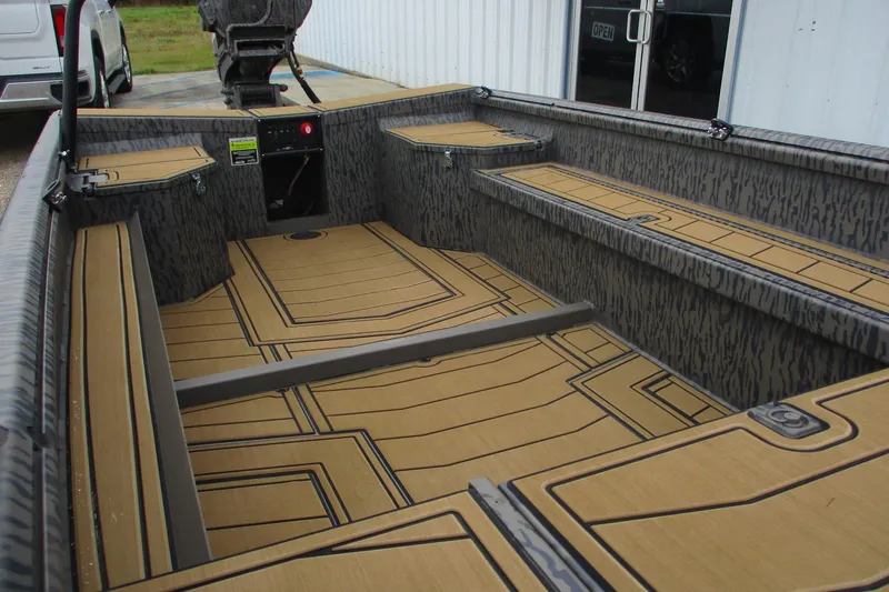 Slide: The Image of 2026 Gator Tail 1750 SAVAGE MIDDECK boat interior with patterned flooring and storage compartments. - 11