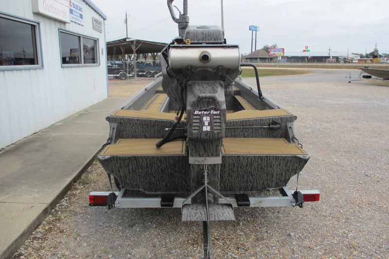 Slide: The Image of 2026 Gator Tail 1750 SAVAGE MIDDECK boat on trailer, outdoor dealership setting. - 6