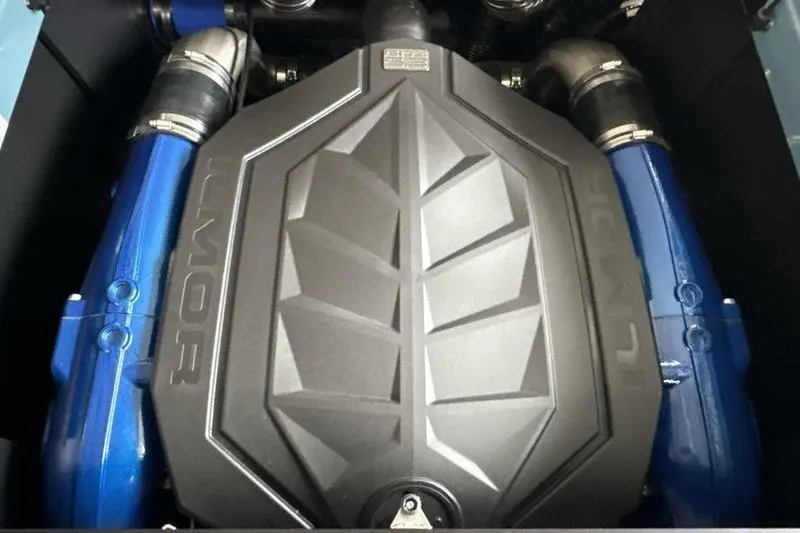 Slide: The Image of Engine of 2026 MasterCraft NXT22 boat with blue accents and sleek design. - 15