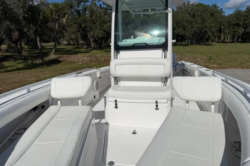 Slide: The Image of 2020 Everglades 253 Center Console boat interior with white seating and console. - 10