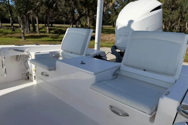 Slide: The Image of 2020 Everglades 253 Center Console boat interior with seating and Yamaha engine. - 11