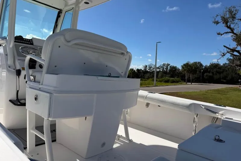 Slide: The Image of 2020 Everglades 253 Center Console boat interior with helm and seating. - 13