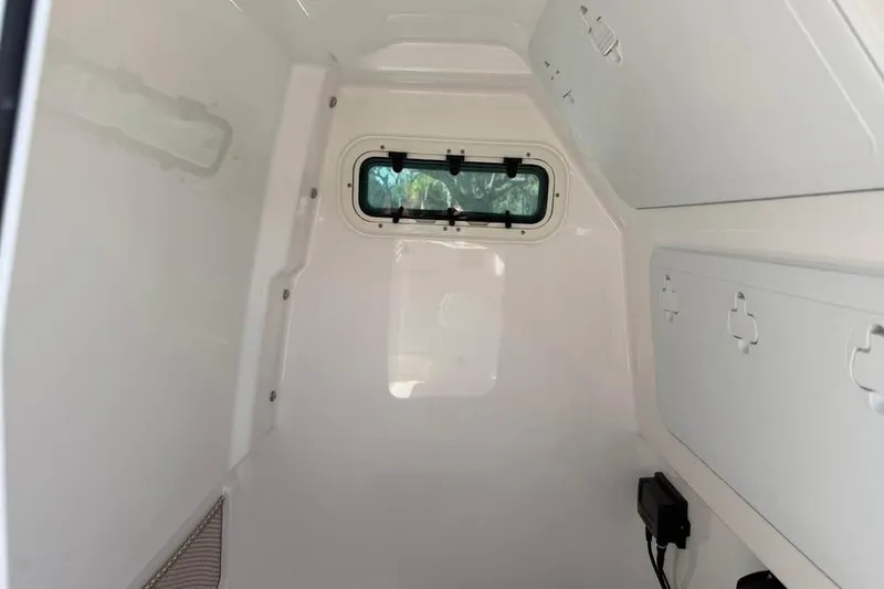 Slide: The Image of Interior cabin of 2020 Everglades 253 Center Console boat, featuring storage compartments. - 15