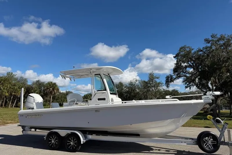 Slide: The Image of 2020 Everglades 253 Center Console boat on trailer under blue sky. - 6