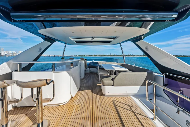 Slide: The Image of Luxurious 2021 Azimut Fly 78 yacht with spacious deck and modern seating, overlooking serene waters. - 26