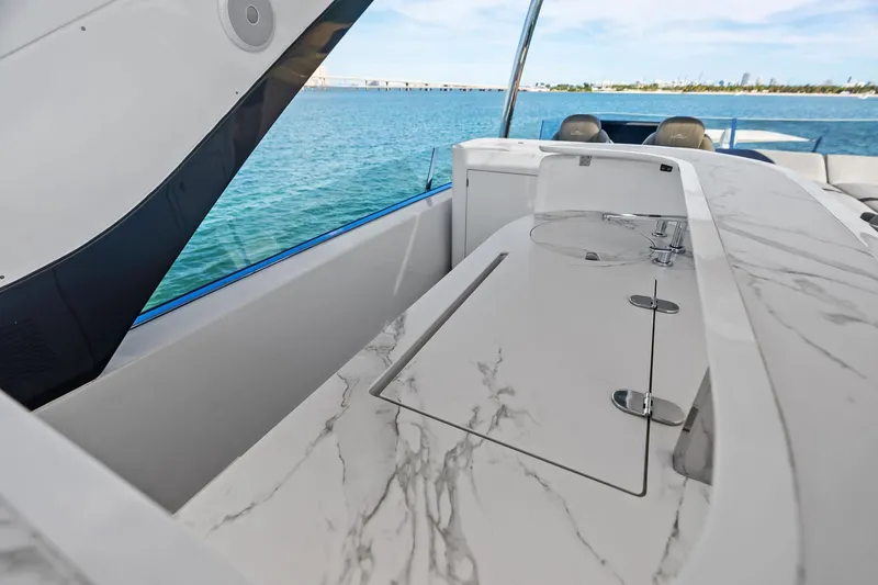 Slide: The Image of Luxurious 2021 Azimut Fly 78 yacht with elegant marble countertop and ocean view. - 32