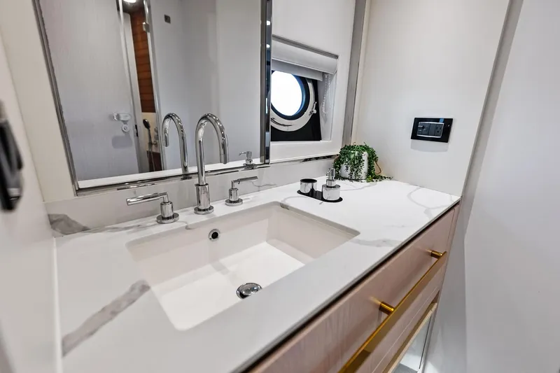 Slide: The Image of Luxurious bathroom sink in 2021 Azimut Fly 78 yacht, featuring modern fixtures and elegant design. - 47