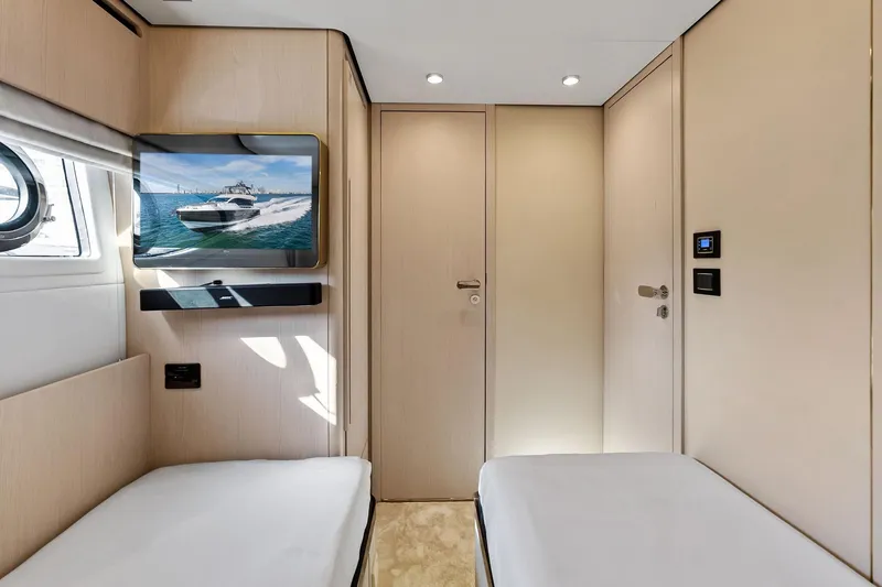 Slide: The Image of Interior of 2021 Azimut Fly 78 yacht cabin with twin beds and wall-mounted TV. - 54