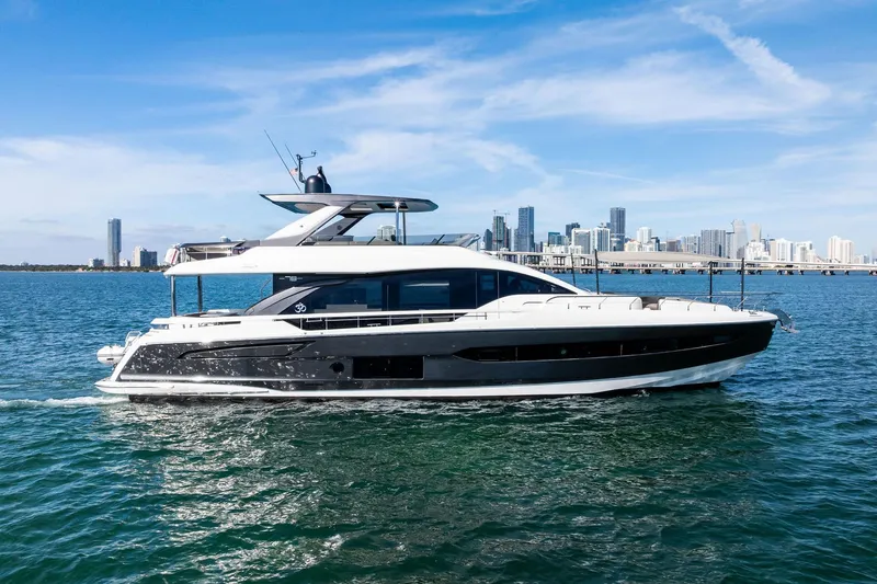 Slide: The Image of 2021 Azimut Fly 78 yacht cruising near city skyline on a sunny day. - 65