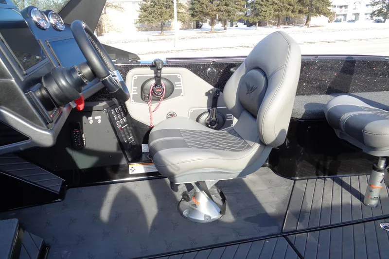 Slide: The Image of 2022 Vexus DVX 22 boat interior with steering wheel and seating. - 41