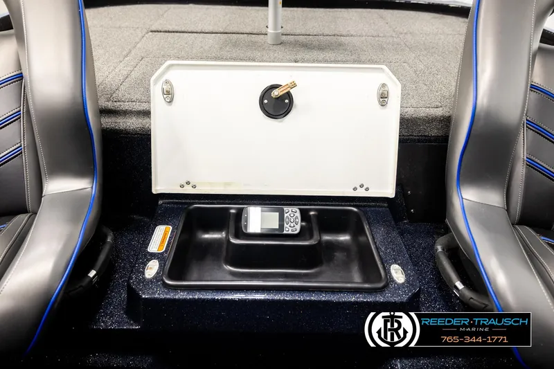 Slide: The Image of 2024 Bass Tracker NitroZ20 boat interior with storage compartment and seating. - 25