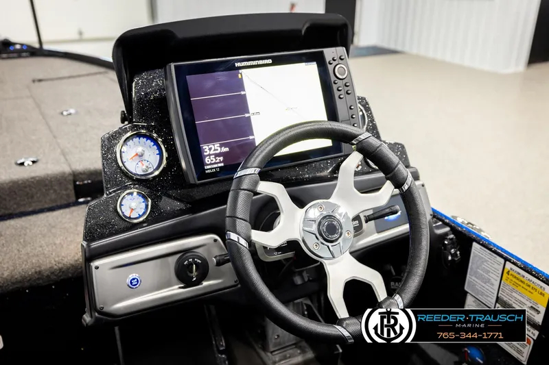 Slide: The Image of 2024 Bass Tracker NitroZ20 boat dashboard with steering wheel and navigation display. - 27