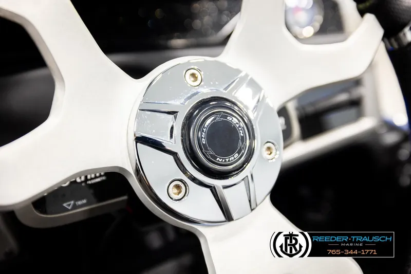Slide: The Image of Steering wheel of 2024 Bass Tracker NitroZ20 boat, featuring sleek chrome design. - 28