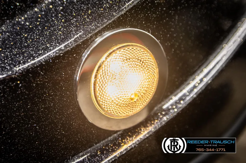 Slide: The Image of Close-up of 2024 Bass Tracker NitroZ20 boat light with Reeder-Trausch Marine logo. - 44