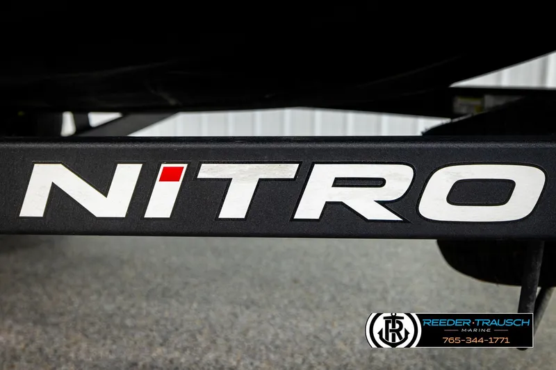 Slide: The Image of 2024 Bass Tracker Nitro Z20 logo on boat trailer, Reeder-Trausch Marine branding visible. - 64