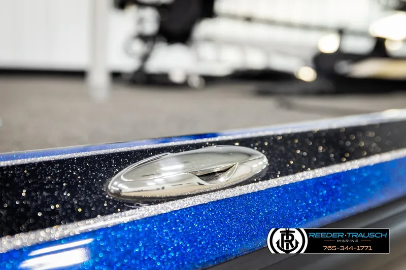 Slide: The Image of 2024 Bass Tracker NitroZ20 boat detail with metallic blue finish and sleek design. - 67