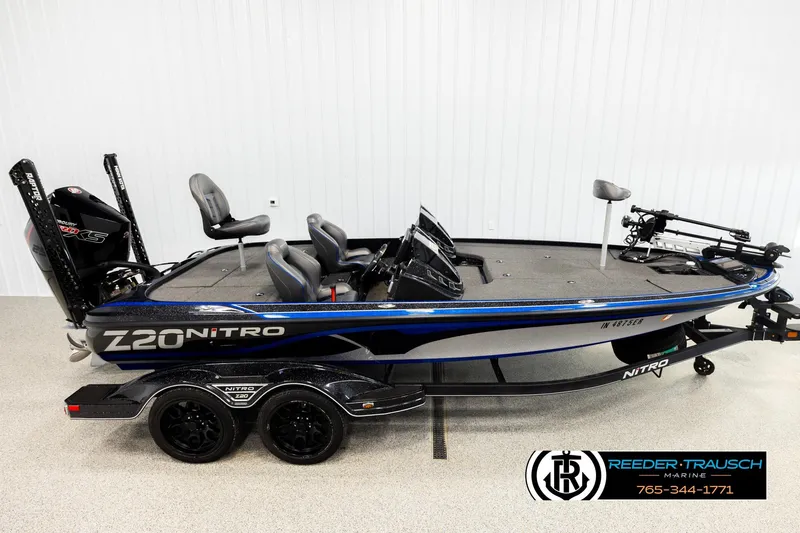 The Image of 2024 Bass Tracker Nitro Z20 boat with dual seats and powerful engine, displayed indoors. - 1