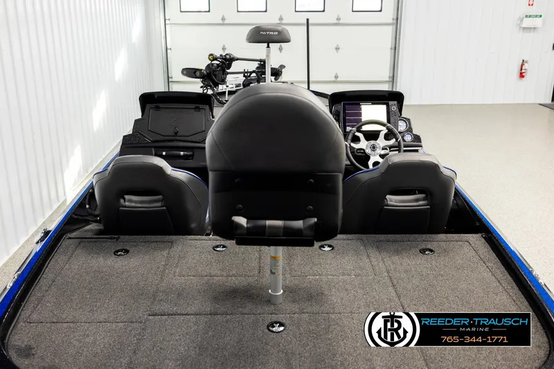 Slide: The Image of 2024 Bass Tracker Nitro Z20 boat interior with steering console and seating. - 12