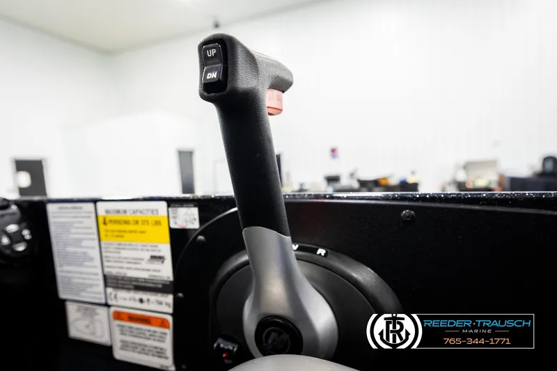 Slide: The Image of 2024 Bass Tracker NitroZ20 throttle control in a marine setting. - 40