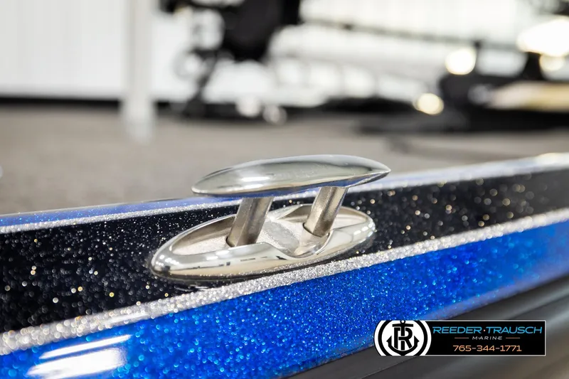 Slide: The Image of 2024 Bass Tracker NitroZ20 boat cleat with blue metallic finish, Reeder-Trausch Marine logo. - 68