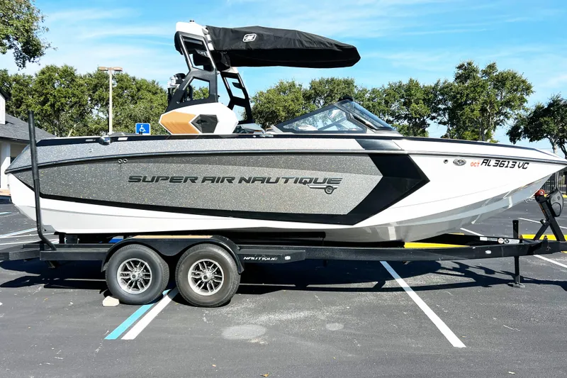 The Image of 2019 Nautique Super Air Nautique G23 boat on trailer in parking lot. - 1