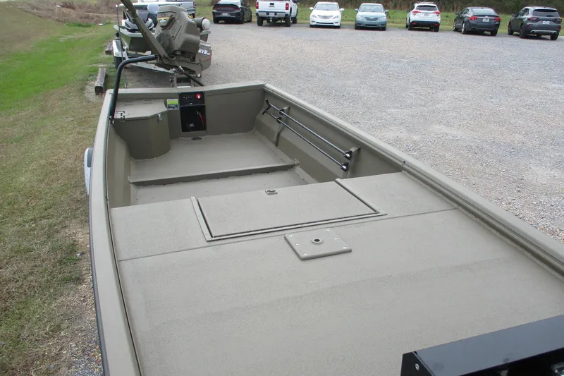 Slide: The Image of 2026 Gator Tail 1748 GATOR boat parked on gravel lot, interior view. - 7