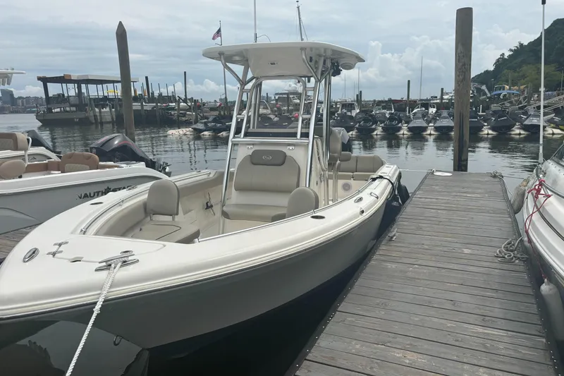 The Image of 2024 Key West 239 FS boat docked at marina, surrounded by other vessels. - 1
