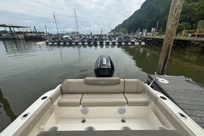 Slide: The Image of 2024 Key West 239 FS boat docked at marina with scenic waterfront view. - 8