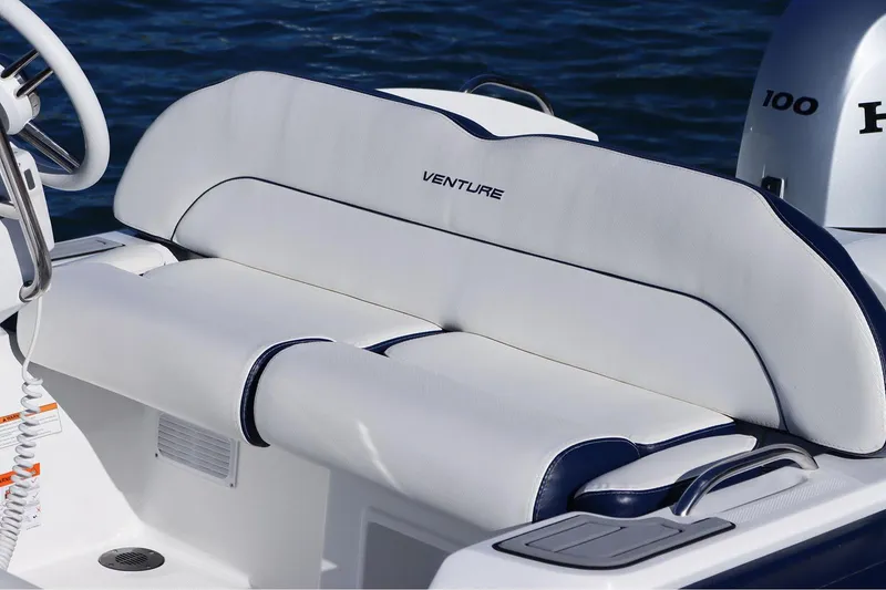 Slide: The Image of Manufacturer Provided Image: 2025 Walker Bay Venture 16 boat seat with white upholstery and blue accents. - 10
