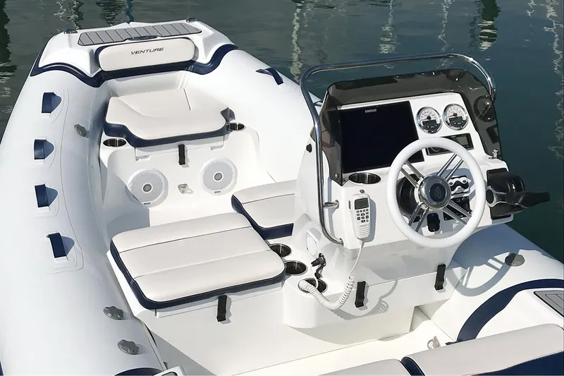 Slide: The Image of Manufacturer Provided Image: 2025 Walker Bay Venture 16 boat interior with modern dashboard and seating. - 6