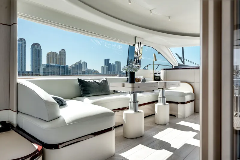 Slide: The Image of Luxurious interior of 2023 Azimut Fly 68 yacht with city skyline view. - 12
