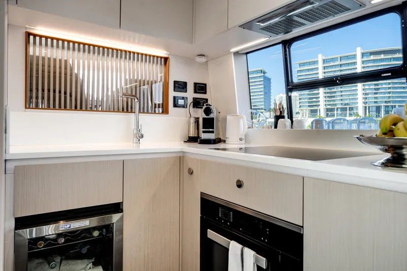 Slide: The Image of Modern kitchen interior of 2023 Azimut Fly 68 yacht with sleek design and appliances. - 15