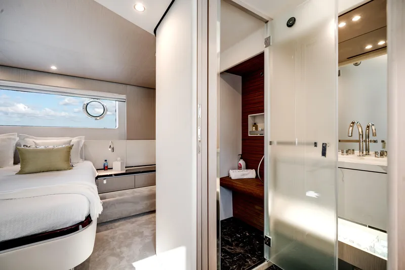 Slide: The Image of Luxurious interior of 2023 Azimut Fly 68 yacht featuring bedroom and bathroom. - 18