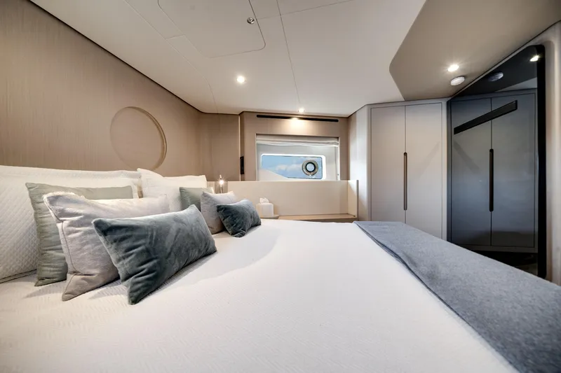Slide: The Image of Luxurious bedroom interior of 2023 Azimut Fly 68 yacht with elegant decor and soft lighting. - 20