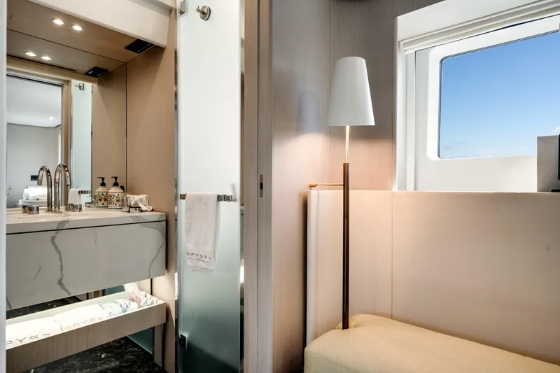 Slide: The Image of Luxurious interior of 2023 Azimut Fly 68 yacht bathroom with modern fixtures and window view. - 29
