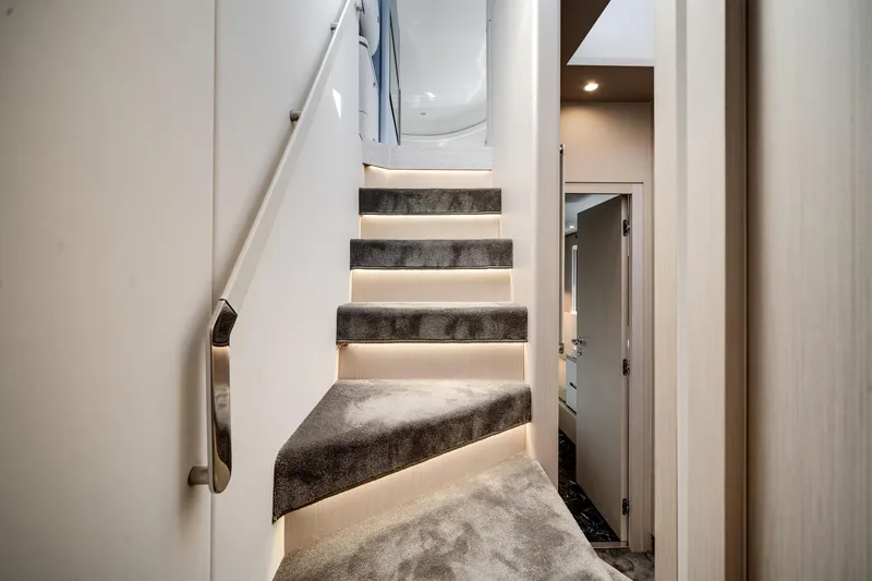 Slide: The Image of Luxurious interior staircase of 2023 Azimut Fly 68 yacht with modern lighting. - 32