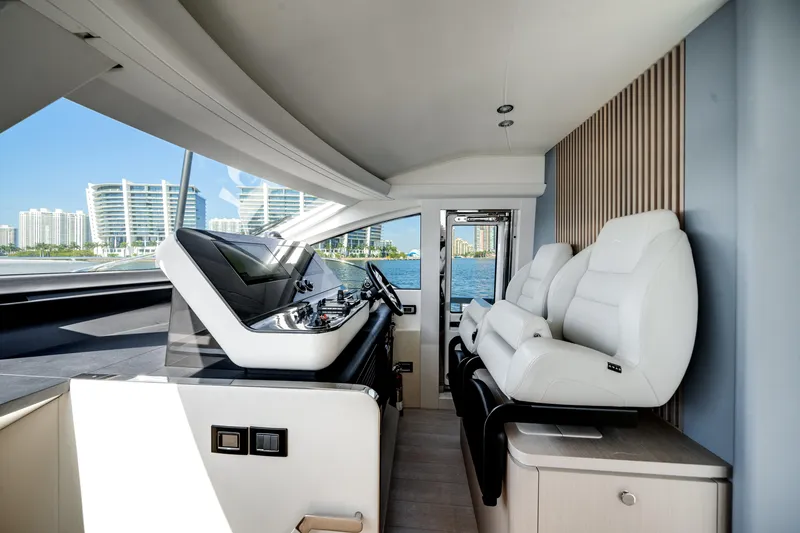 Slide: The Image of Luxurious interior of 2023 Azimut Fly 68 yacht with modern helm and plush seating. - 33