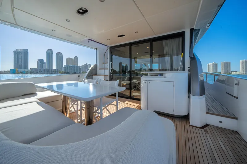 Slide: The Image of Luxurious 2023 Azimut Fly 68 yacht deck with city skyline view. - 35