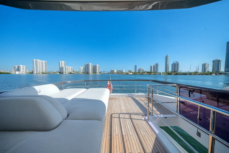Slide: The Image of Luxurious 2023 Azimut Fly 68 yacht deck with city skyline view. - 36