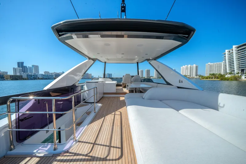 Slide: The Image of Luxurious 2023 Azimut Fly 68 yacht deck with city skyline view. - 37